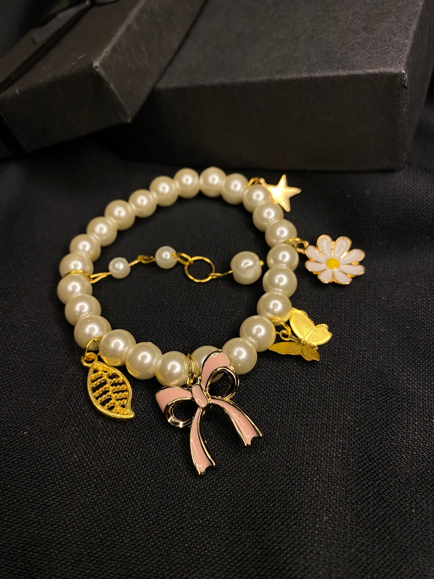 BRPMCH-00- Pearls Bracelet with Mix Charms( Butterfly, Daisy Flower, Bow, Leaf, Star)