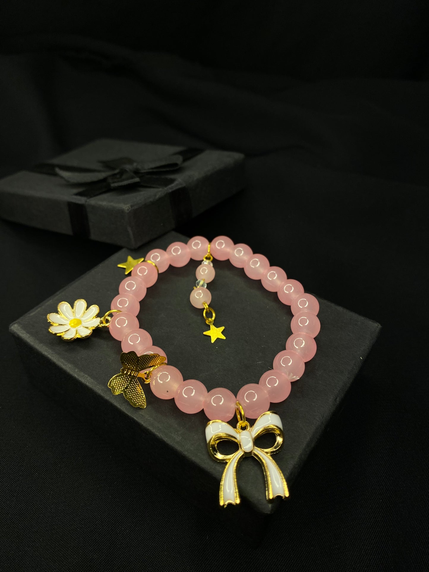 BRPNST-02-Pink Stone Bracelet with Hanging Charms( Daisy Flower, Star Butterfly, Bow)