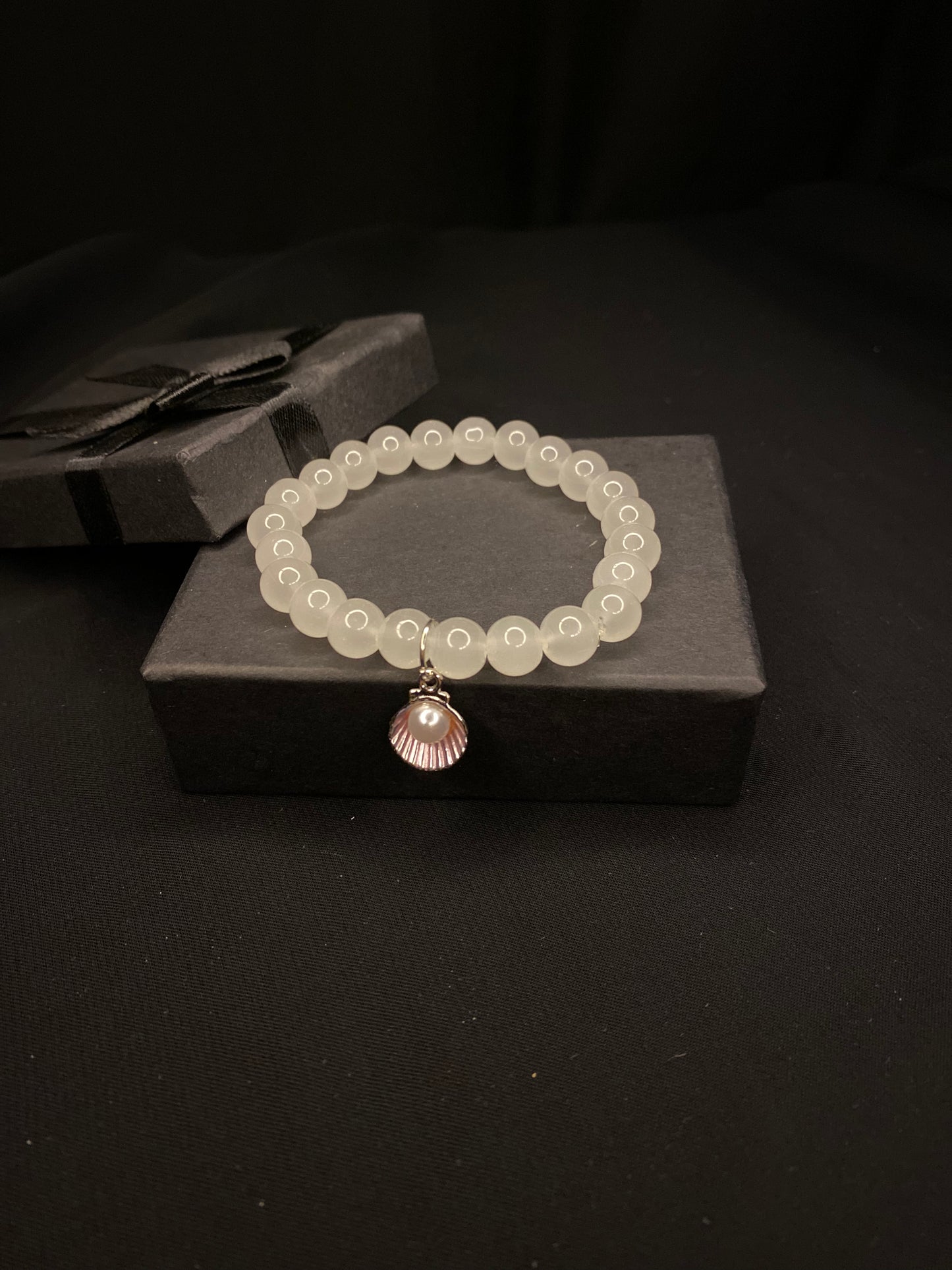 BRSTSHCH-00- Moon stone bracelet with shell charm