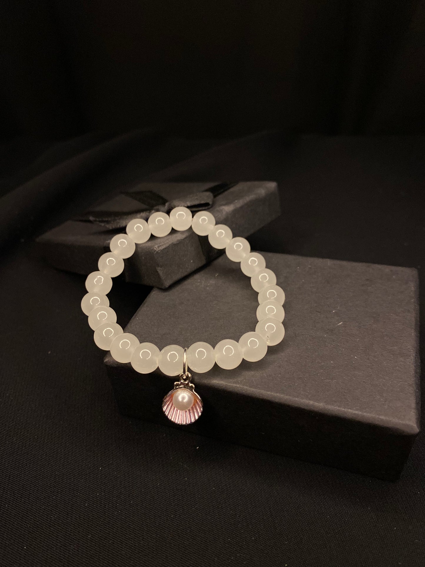 BRSTSHCH-00- Moon stone bracelet with shell charm