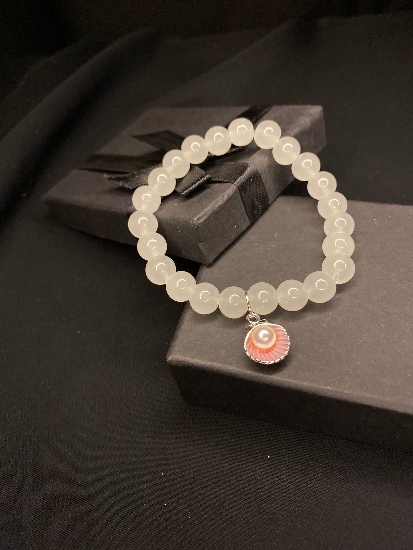 BRSTSHCH-00- Moon stone bracelet with shell charm